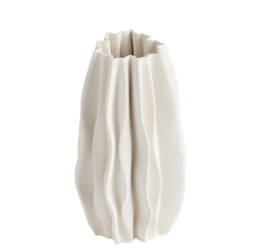 White ceramic vase with textured surface on a white background