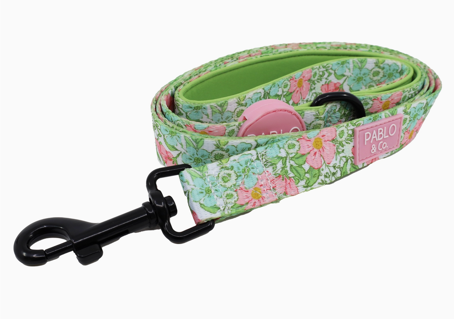 Floral-patterned dog leash with a pink clip on a white background