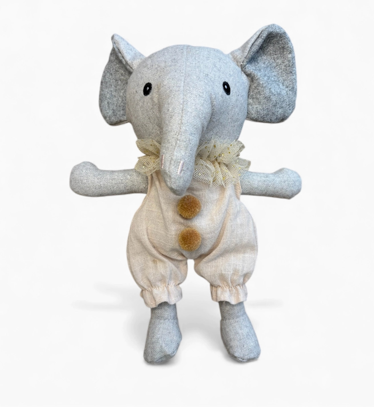Stuffed elephant toy with a diaper on a white background